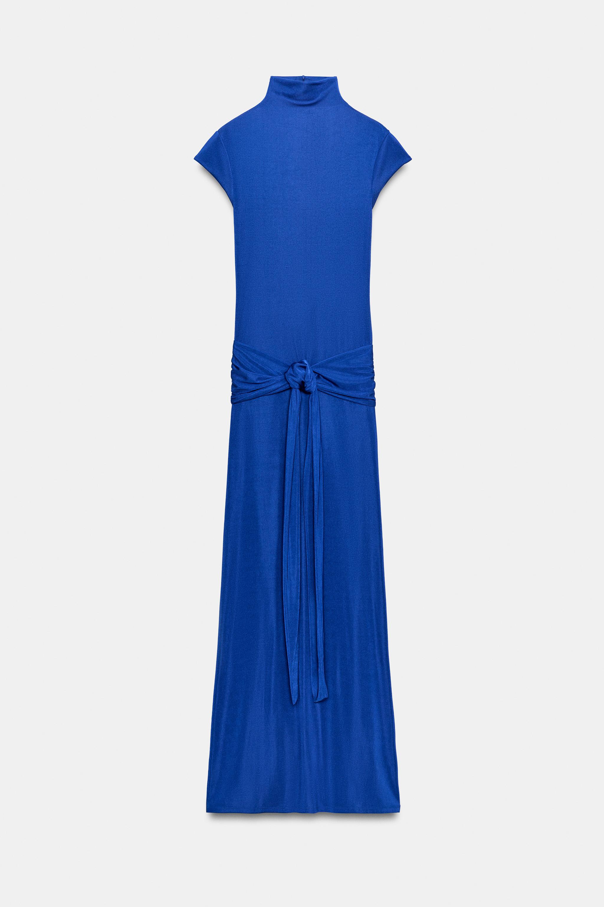 ROBE LONGUE À NŒUD ET OUVERTURE